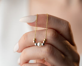 Detailed view of handmade craftsmanship in pearl necklace