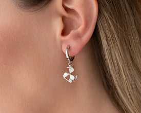 Close-up detailing the handcrafted silver propeller design