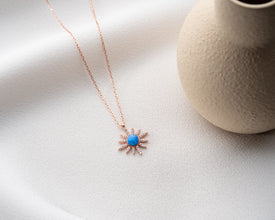 Close-up of the sterling silver moon and star charm necklace highlighting its polished finish.