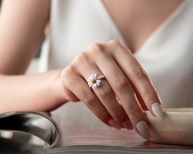 Picnic lifestyle shot featuring floral ring on cheese board