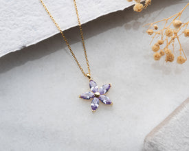 Charming lavender bloom silver necklace, a stunning and symbolic jewelry piece.