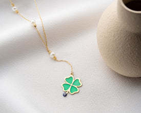 Gift-ready charm necklace displayed in branded box