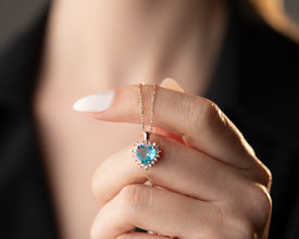 Dainty and minimalist gemstone necklace featuring a heart-shaped aquamarine.