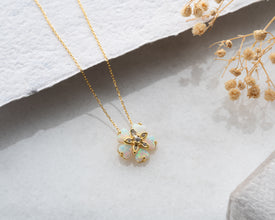 Elegant and feminine opal flower necklace in sterling silver, designed for minimalists and bohemian jewelry lovers.