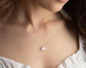 Minimalist silver and gold opal cloud necklace for everyday wear.