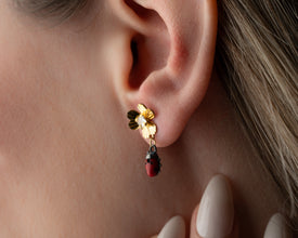 Close-up of silver ladybug earrings, cute bug-themed jewelry