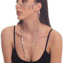 Elegant boho-style silver face chain accessory draped across the nose and cheek area.