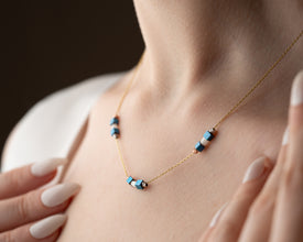 Minimalist Hematite Bar Necklace laid flat with sterling silver chain