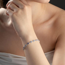 Close-up of a person wearing a bracelet with a blurred background