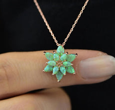 A minimalist sterling silver lotus pendant, perfect for layering or wearing as a statement jewelry piece.